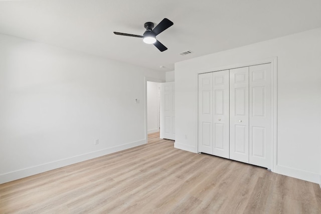 14806 Parco Path, Pflugerville, TX 78660 - unfurnished bedroom featuring light wood-style floors, a closet, baseboards, and ceiling fan