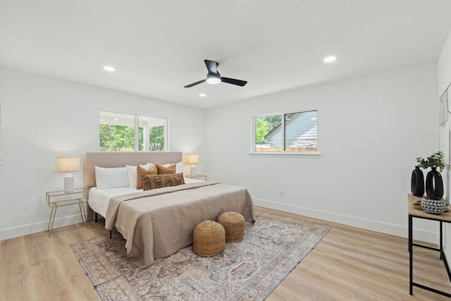 14806 Parco Path, Pflugerville, TX 78660 - bedroom with multiple windows, light wood-style floors, baseboards, and recessed lighting