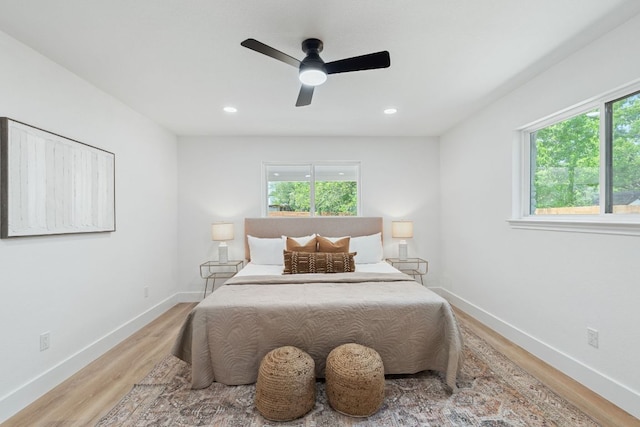 14806 Parco Path, Pflugerville, TX 78660 - bedroom featuring multiple windows, light wood-type flooring, baseboards, and recessed lighting