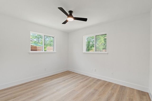 14806 Parco Path, Pflugerville, TX 78660 - unfurnished room with plenty of natural light, light wood finished floors, baseboards, and ceiling fan