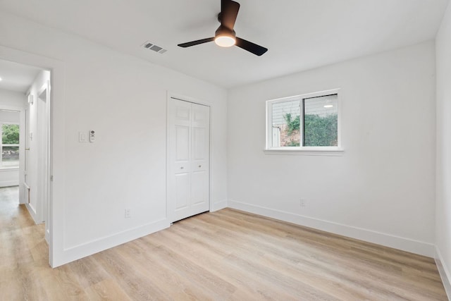 14806 Parco Path, Pflugerville, TX 78660 - unfurnished bedroom with light wood-style flooring, baseboards, and a closet