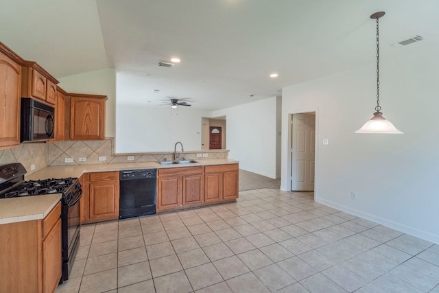 19642 Summerlin Dr, Katy, TX 77449 - kitchen featuring black appliances, a sink, a peninsula, light countertops, and decorative backsplash