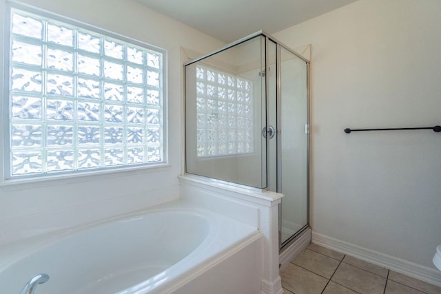 19642 Summerlin Dr, Katy, TX 77449 - full bath with a bath, tile patterned floors, a stall shower, and baseboards