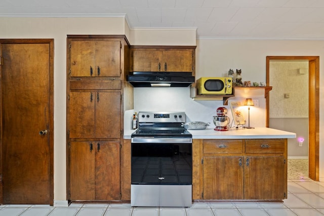 1603 Purple Sage, Horseshoe Bay, TX 78657 - kitchen with stainless steel electric range oven, under cabinet range hood, ornamental molding, brown cabinets, and light countertops