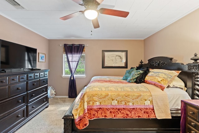 1603 Purple Sage, Horseshoe Bay, TX 78657 - bedroom featuring carpet, crown molding, baseboards, and a ceiling fan