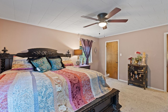 1603 Purple Sage, Horseshoe Bay, TX 78657 - carpeted bedroom featuring a ceiling fan and ornamental molding