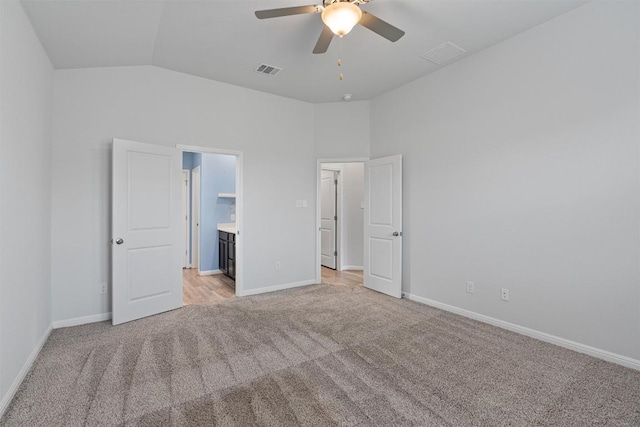 16816 Caperi Dr, Pflugerville, TX 78660 - unfurnished bedroom with light carpet, lofted ceiling, baseboards, a ceiling fan, and ensuite bathroom