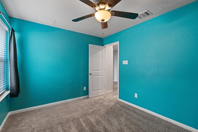 16816 Caperi Dr, Pflugerville, TX 78660 - carpeted empty room with ceiling fan, baseboards, and healthy amount of natural light
