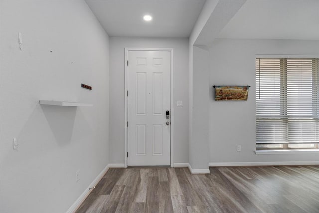 16816 Caperi Dr, Pflugerville, TX 78660 - foyer entrance featuring wood finished floors, baseboards, healthy amount of natural light, and recessed lighting