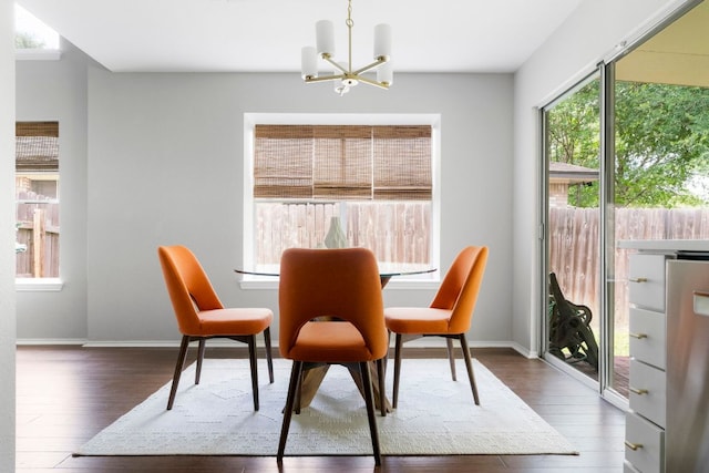 9325 Linkmeadow Dr, Austin, TX 78748 - dining room with a chandelier, wood finished floors, healthy amount of natural light, and baseboards