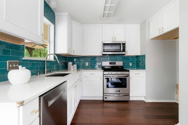 9325 Linkmeadow Dr, Austin, TX 78748 - kitchen with appliances with stainless steel finishes, a sink, decorative backsplash, light countertops, and dark wood finished floors