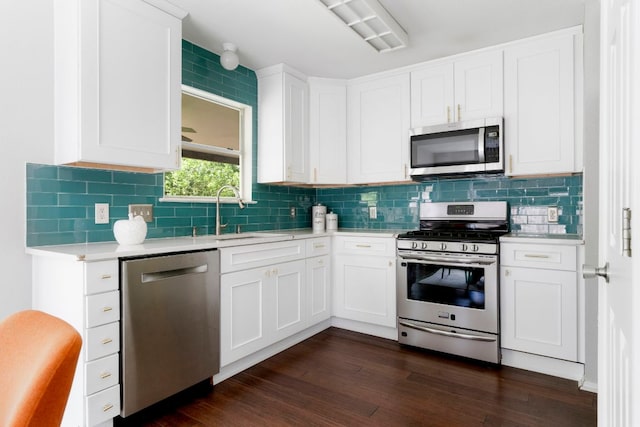 9325 Linkmeadow Dr, Austin, TX 78748 - kitchen with appliances with stainless steel finishes, light countertops, tasteful backsplash, a sink, and white cabinets
