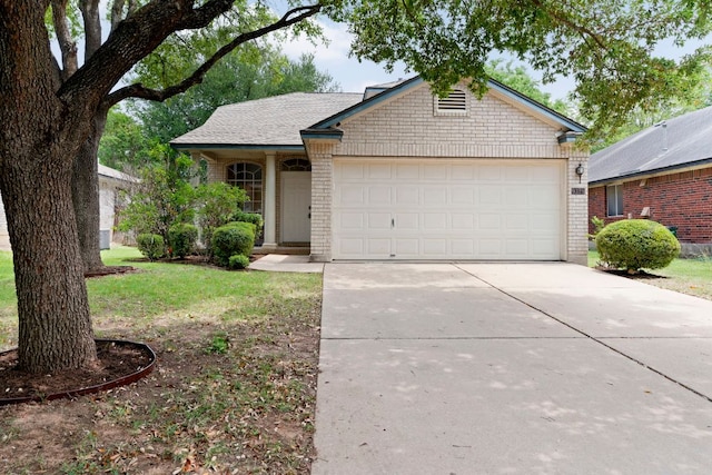 9325 Linkmeadow Dr, Austin, TX 78748 - ranch-style home with brick siding, concrete driveway, a garage, and a front yard