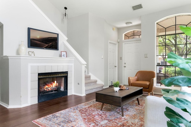 9325 Linkmeadow Dr, Austin, TX 78748 - living room with wood finished floors, a fireplace, stairs, and baseboards