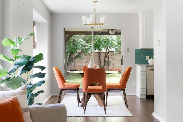 9325 Linkmeadow Dr, Austin, TX 78748 - dining space featuring a chandelier, wood finished floors, and baseboards