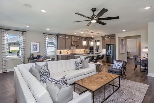 9512 Hamadryas Dr, Austin, TX 78744 - living area featuring baseboards, ceiling fan, recessed lighting, and dark wood finished floors