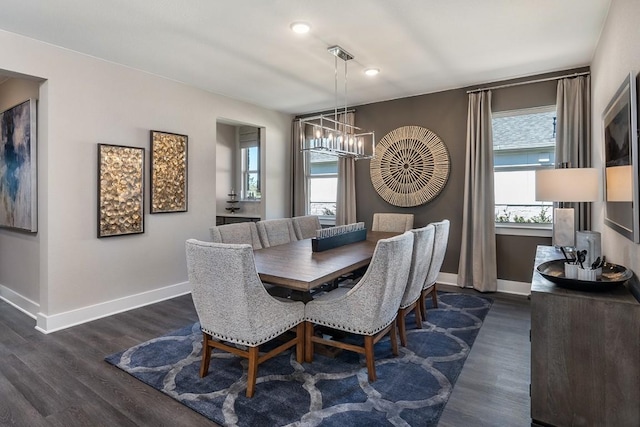 9512 Hamadryas Dr, Austin, TX 78744 - dining area with baseboards, a chandelier, dark wood finished floors, and recessed lighting