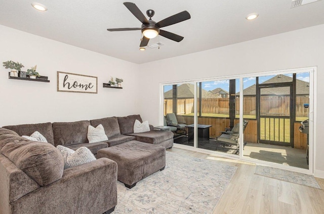 119 Nandina Path, Bastrop, TX 78602 - living area with wood finished floors, ceiling fan, and recessed lighting
