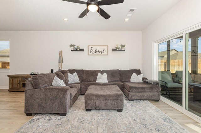 119 Nandina Path, Bastrop, TX 78602 - living room with light wood-style floors, healthy amount of natural light, ceiling fan, and recessed lighting