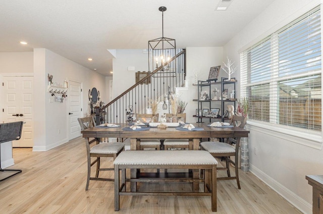 119 Nandina Path, Bastrop, TX 78602 - dining room with stairway, light wood-type flooring, baseboards, a chandelier, and recessed lighting