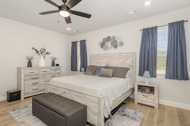 119 Nandina Path, Bastrop, TX 78602 - bedroom with baseboards, light wood-type flooring, ceiling fan, and recessed lighting