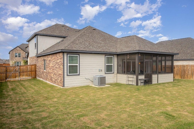 119 Nandina Path, Bastrop, TX 78602 - rear view of property featuring central air condition unit, a shingled roof, a sunroom, and brick siding