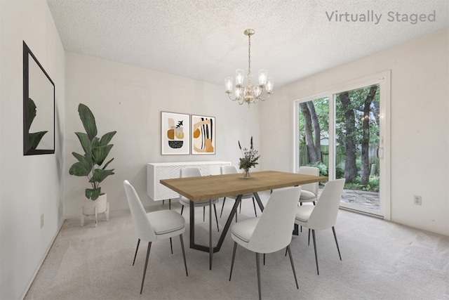 13204 Tamayo Dr, Austin, TX 78729 - dining area featuring a chandelier, light colored carpet, and a textured ceiling