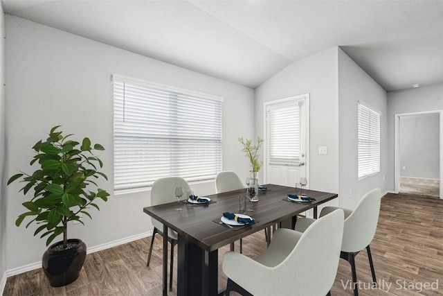 6000 Shanjia Dr, Austin, TX 78724 - dining space with baseboards, plenty of natural light, wood finished floors, and vaulted ceiling