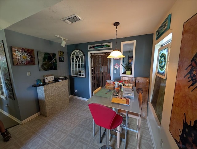 13603 Overland Pass, Bee Cave, TX 78738 - dining space featuring tile patterned floors and baseboards