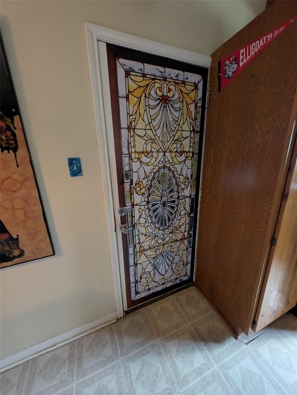 13603 Overland Pass, Bee Cave, TX 78738 - detailed view of baseboards and tile patterned floors