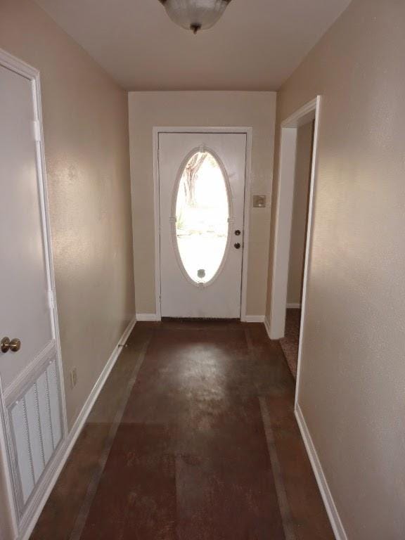 13603 Overland Pass, Bee Cave, TX 78738 - doorway to outside featuring baseboards