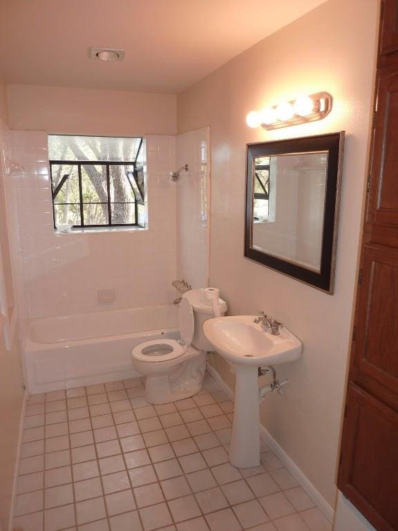 13603 Overland Pass, Bee Cave, TX 78738 - bathroom with tile patterned flooring, toilet, washtub / shower combination, and baseboards