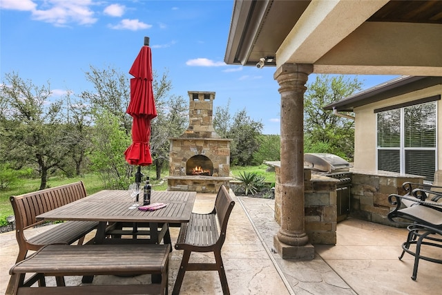 4908 Canyon Ranch Trl, Spicewood, TX 78669 - view of patio featuring an outdoor stone fireplace and outdoor dining space