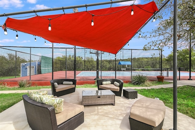 4908 Canyon Ranch Trl, Spicewood, TX 78669 - view of home's community with a tennis court and outdoor lounge area