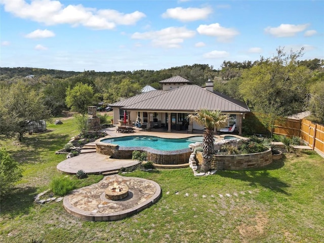 4908 Canyon Ranch Trl, Spicewood, TX 78669 - swimming pool featuring a patio, a view of trees, and an in-ground hot tub