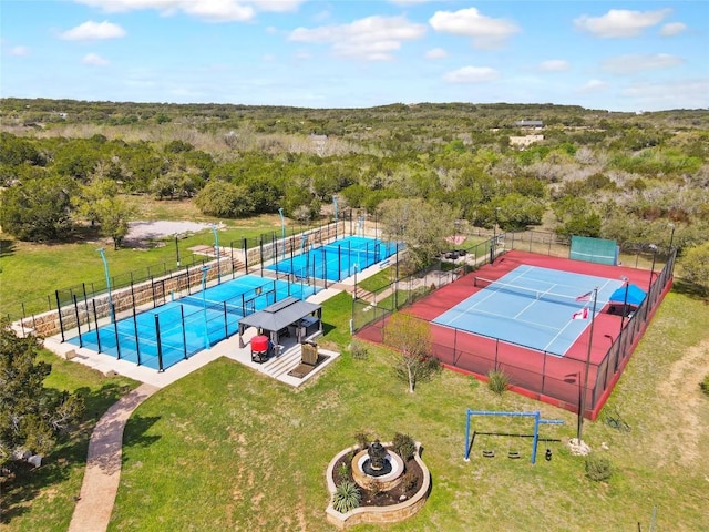 4908 Canyon Ranch Trl, Spicewood, TX 78669 - drone / aerial view of a pool area and a heavily wooded area