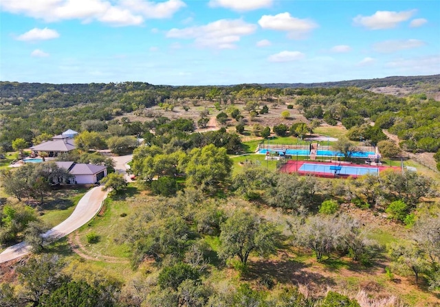 4908 Canyon Ranch Trl, Spicewood, TX 78669 - aerial view of property and surrounding area with a pool and a heavily wooded area