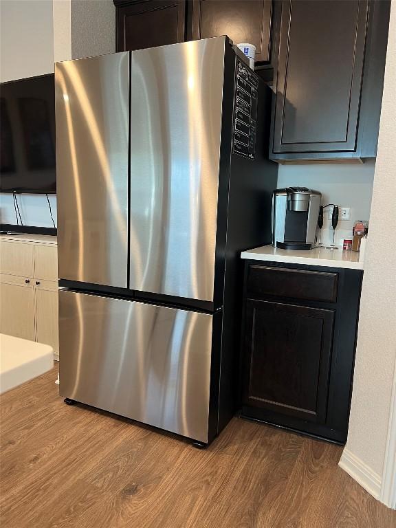 248 Lone Cedar Rd, Marble Falls, TX 78654 - kitchen with freestanding refrigerator, wood finished floors, and light countertops