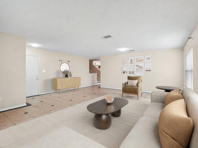 2727 High Point Dr, Round Rock, TX 78664 - living room featuring stairs and tile patterned floors
