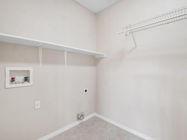 2727 High Point Dr, Round Rock, TX 78664 - washroom featuring hookup for a washing machine, hookup for an electric dryer, baseboards, and light tile patterned flooring