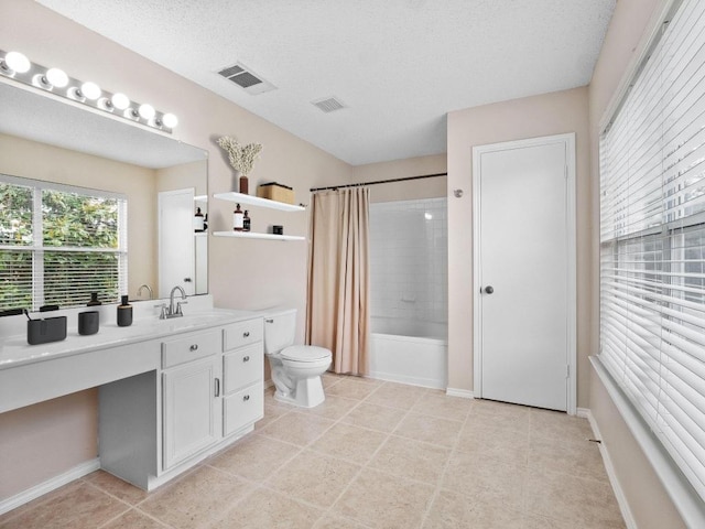 2727 High Point Dr, Round Rock, TX 78664 - full bathroom featuring vanity, toilet, shower / bath combo with shower curtain, tile patterned floors, and a textured ceiling