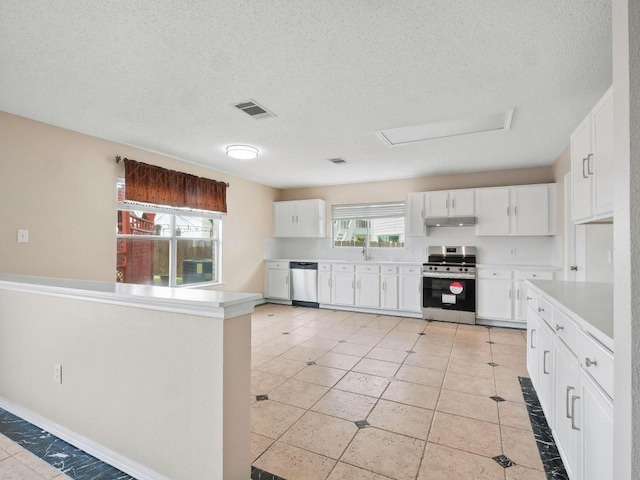 2727 High Point Dr, Round Rock, TX 78664 - kitchen with stainless steel appliances, under cabinet range hood, white cabinetry, a textured ceiling, and light countertops