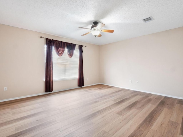 2727 High Point Dr, Round Rock, TX 78664 - unfurnished room with a ceiling fan, light wood-type flooring, a textured ceiling, and baseboards