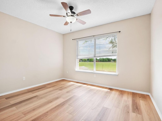 2727 High Point Dr, Round Rock, TX 78664 - spare room featuring ceiling fan, light wood-style floors, baseboards, and a textured ceiling