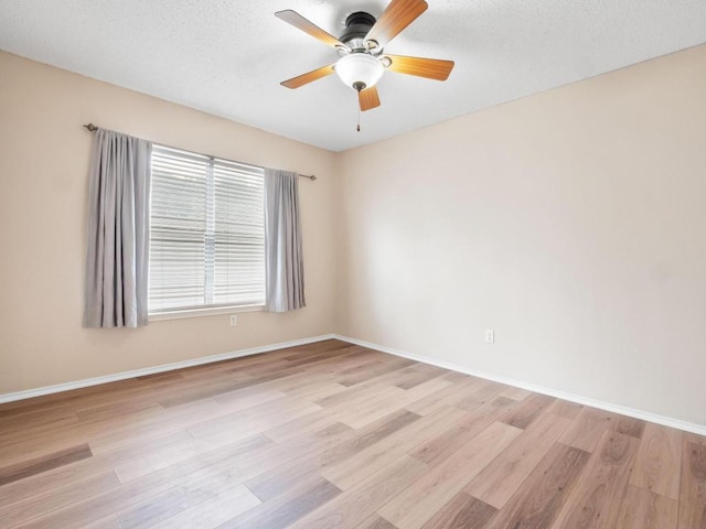 2727 High Point Dr, Round Rock, TX 78664 - empty room with light wood-style floors, ceiling fan, baseboards, and a textured ceiling
