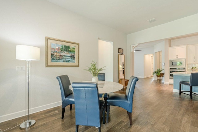 305 Dashing Sycamore St, San Marcos, TX 78666 - dining area with dark wood-type flooring and baseboards