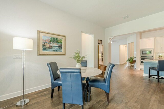 305 Dashing Sycamore St, San Marcos, TX 78666 - dining space featuring dark wood-style floors and baseboards