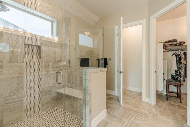 305 Dashing Sycamore St, San Marcos, TX 78666 - full bathroom featuring a stall shower, a walk in closet, and baseboards
