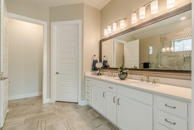 305 Dashing Sycamore St, San Marcos, TX 78666 - full bath with tiled shower, double vanity, and baseboards