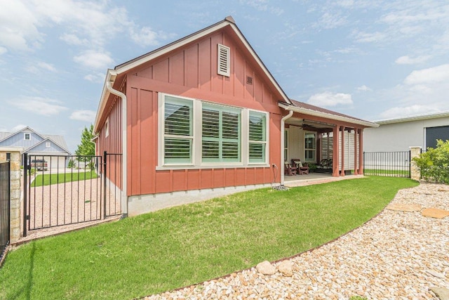 305 Dashing Sycamore St, San Marcos, TX 78666 - rear view of house with board and batten siding, a patio area, and ceiling fan